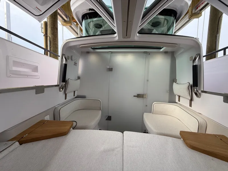 Slide: The Image of Interior of 2025 Axopar 37 XC Cross Cabin with modern seating. - 11
