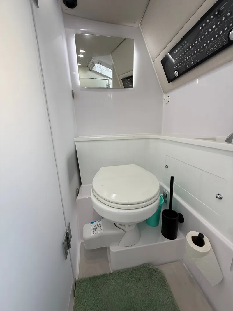 Slide: The Image of Bathroom in Axopar 37 XC Cross Cabin 2025 boat. - 13