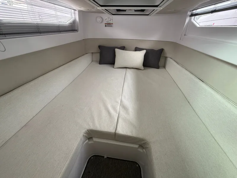 Slide: The Image of Interior of 2025 Axopar 37 XC Cross Cabin with cozy bed. - 19
