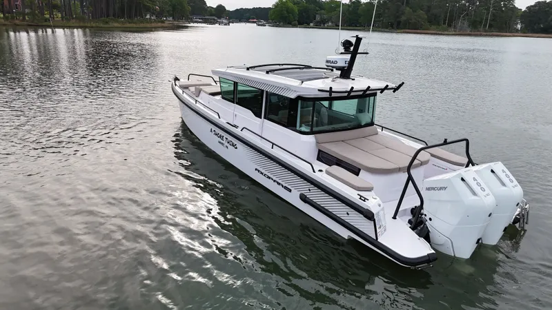 Slide: The Image of Axopar 37 XC Cross Cabin 2025 on calm waters. - 2
