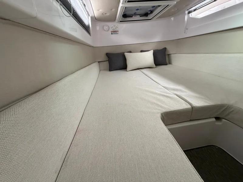 Slide: The Image of Interior of 2025 Axopar 37 XC Cross Cabin with beige sofa. - 20