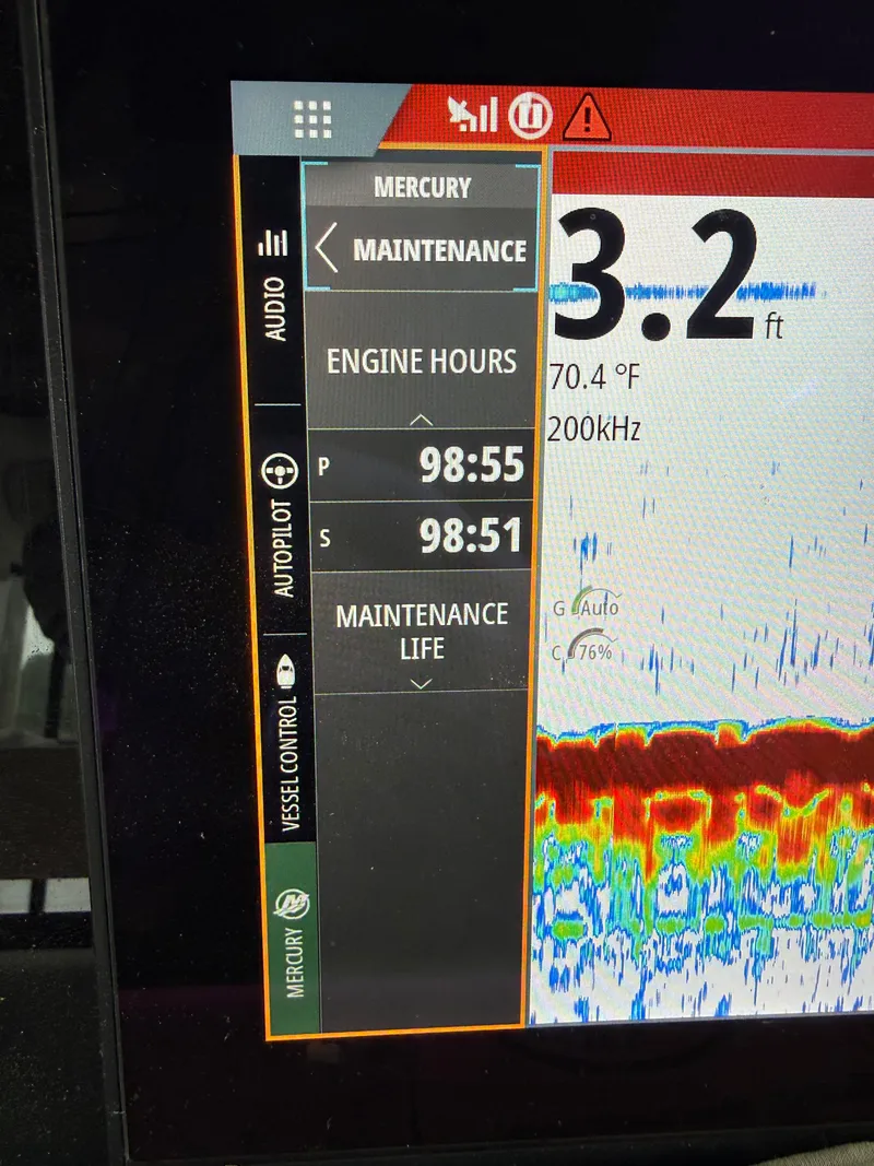 Slide: The Image of Axopar 37 XC 2025 boat display showing engine hours and maintenance data. - 21