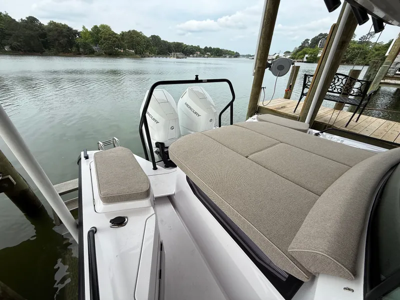 Slide: The Image of Axopar 37 XC Cross Cabin 2025 with Mercury engines by the lake. - 22
