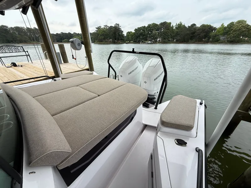 Slide: The Image of Axopar 37 XC Cross Cabin 2025 with Mercury engines by the lake. - 24