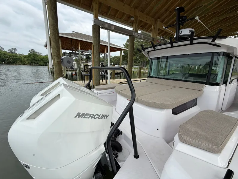 Slide: The Image of Axopar 37 XC Cross Cabin 2025 with Mercury engine at dock. - 25