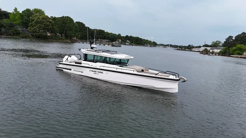Slide: The Image of Axopar 37 XC Cross Cabin 2025 on calm waters. - 26