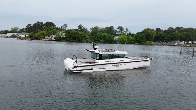 Slide: The Image of Axopar 37 XC Cross Cabin 2025 on calm waters. - 28