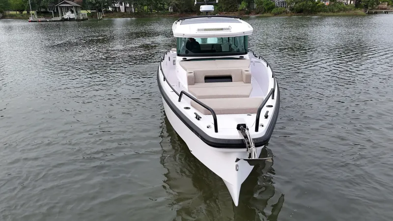 Slide: The Image of Axopar 37 XC Cross Cabin 2025 on calm water. - 34