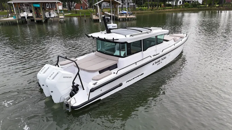 Slide: The Image of 2025 Axopar 37 XC Cross Cabin on calm water. - 39