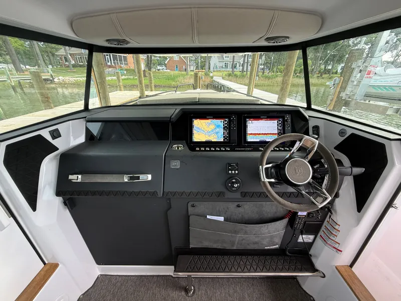 Slide: The Image of Interior of 2025 Axopar 37 XC Cross Cabin with modern helm console. - 4