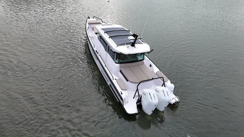 Slide: The Image of Axopar 37 XC Cross Cabin 2025 on calm water. - 40