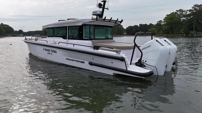 Slide: The Image of 2025 Axopar 37 XC Cross Cabin on calm waters. - 42