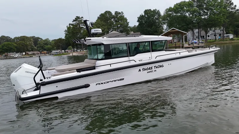 Slide: The Image of Axopar 37 XC Cross Cabin 2025 on calm waters. - 43