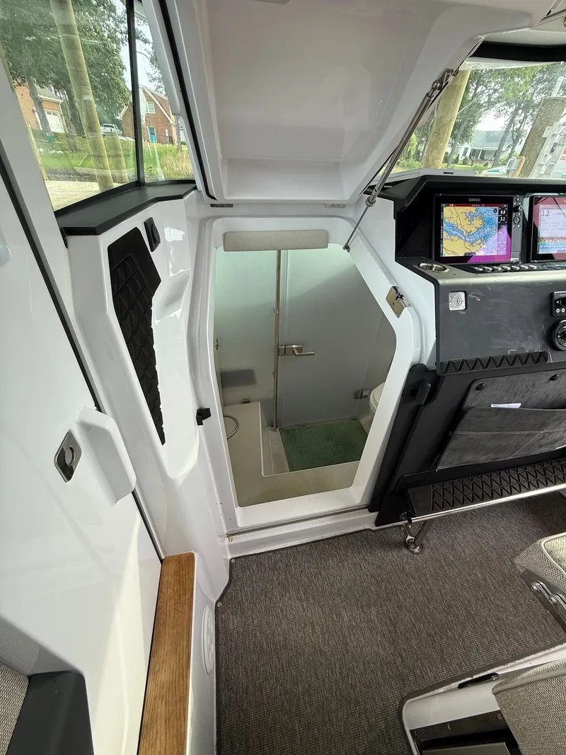 Slide: The Image of Interior of 2025 Axopar 37 XC Cross Cabin with modern features. - 8
