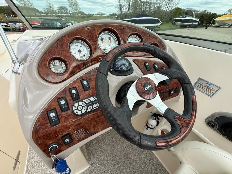 Slide: The Image of Dashboard of a 2004 Rinker 262 Captiva Bowrider boat. - 14