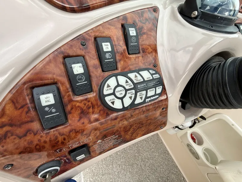 Slide: The Image of Dashboard of 2004 Rinker 262 Captiva Bowrider with controls. - 15