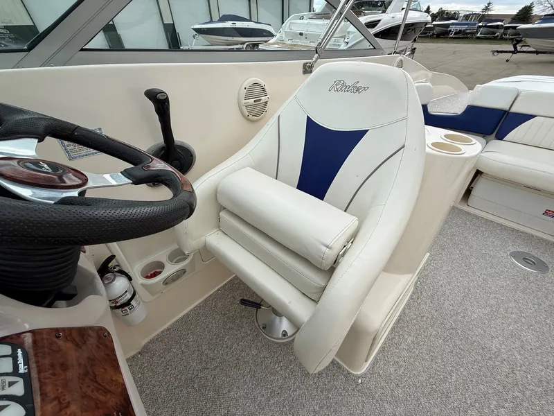 Slide: The Image of Interior of a 2004 Rinker 262 Captiva Bowrider boat. - 17