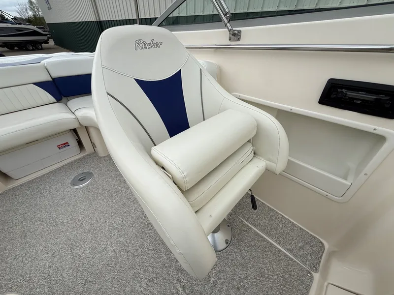Slide: The Image of Interior of a 2004 Rinker 262 Captiva Bowrider with white seating. - 18