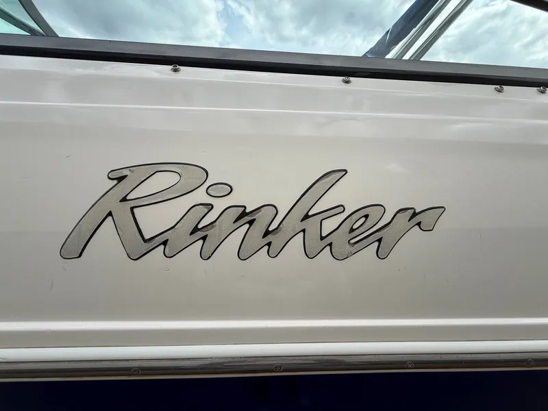 Slide: The Image of Rinker 262 Captiva Bowrider 2004 logo on boat hull. - 4
