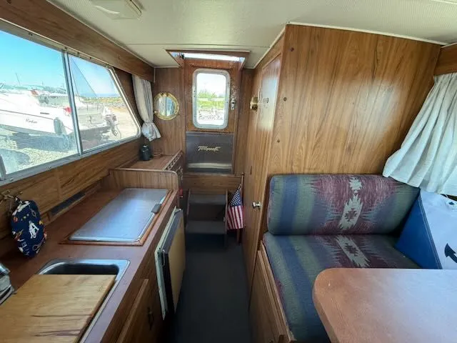 Slide: The Image of Interior of a 1979 Tollycraft 26 yacht with wood paneling. - 10