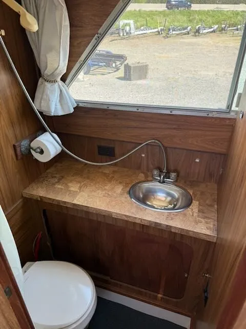 Slide: The Image of Interior of a 1979 Tollycraft 26 with sink and toilet. - 14