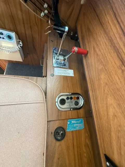 Slide: The Image of Interior of a 1979 Tollycraft 26 with control lever and wood paneling. - 19