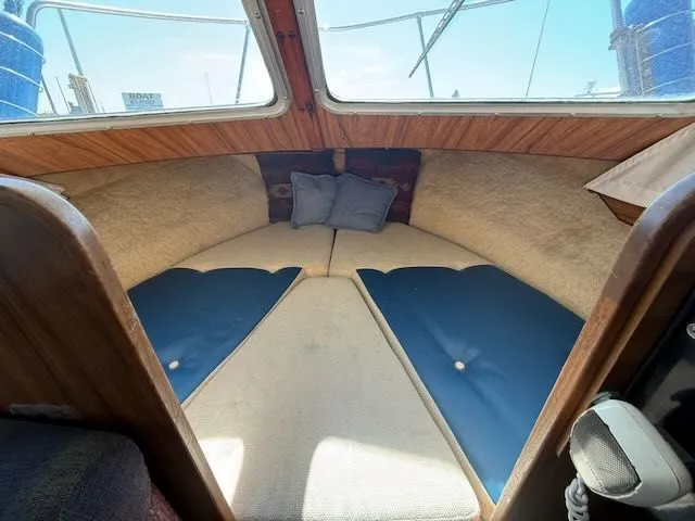 Slide: The Image of Interior of a 1979 Tollycraft 26 with blue cushions. - 21