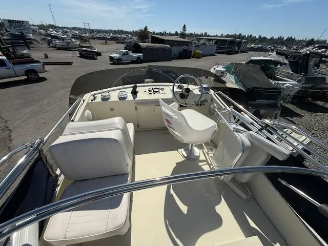 Slide: The Image of Interior view of a 1979 Tollycraft 26 boat with helm station. - 22