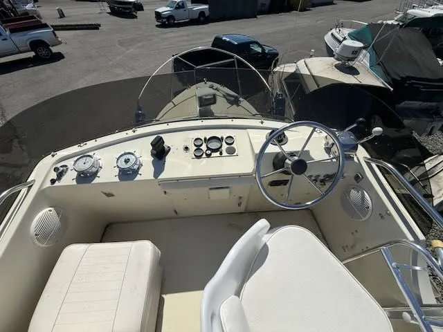 Slide: The Image of Cockpit of a 1979 Tollycraft 26 boat with steering wheel and instruments. - 23