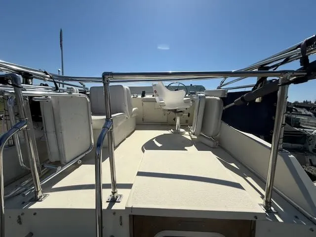 Slide: The Image of Deck of a 1979 Tollycraft 26 boat under sunny skies. - 24