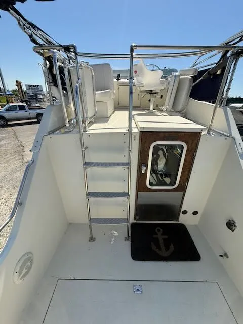 Slide: The Image of 1979 Tollycraft 26 boat with ladder and helm area. - 3