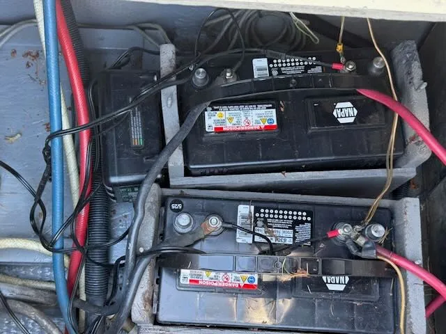 Slide: The Image of Batteries in a 1979 Tollycraft 26 boat engine compartment. - 6