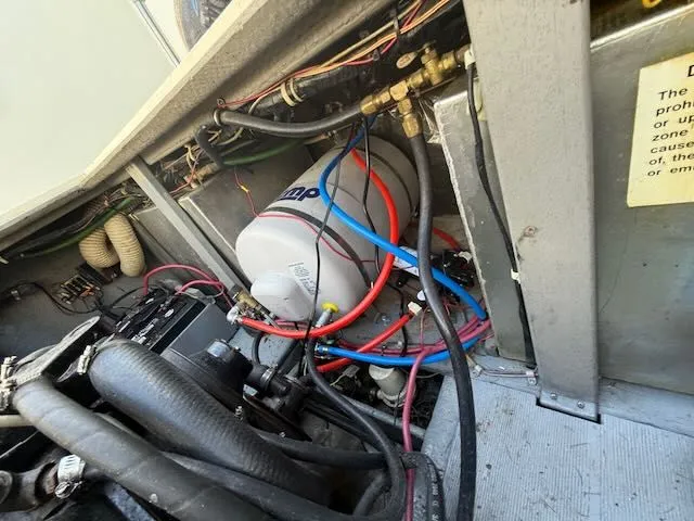 Slide: The Image of Engine compartment of a 1979 Tollycraft 26 with wiring and components. - 7