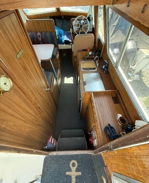 Slide: The Image of Interior of a 1979 Tollycraft 26 boat with wooden furnishings. - 8