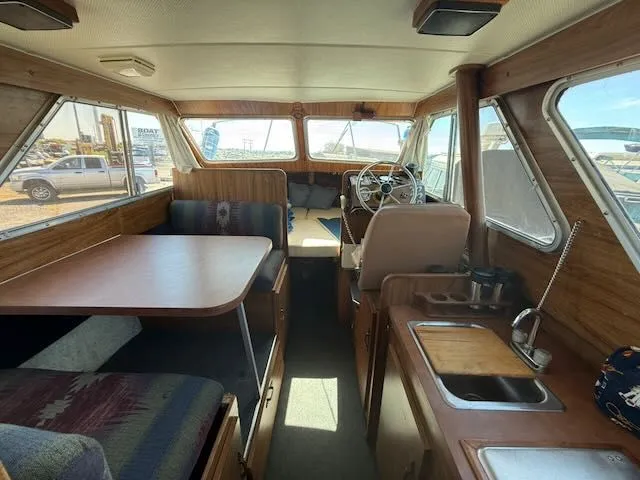 Slide: The Image of Interior of a 1979 Tollycraft 26 yacht with wooden furnishings. - 9