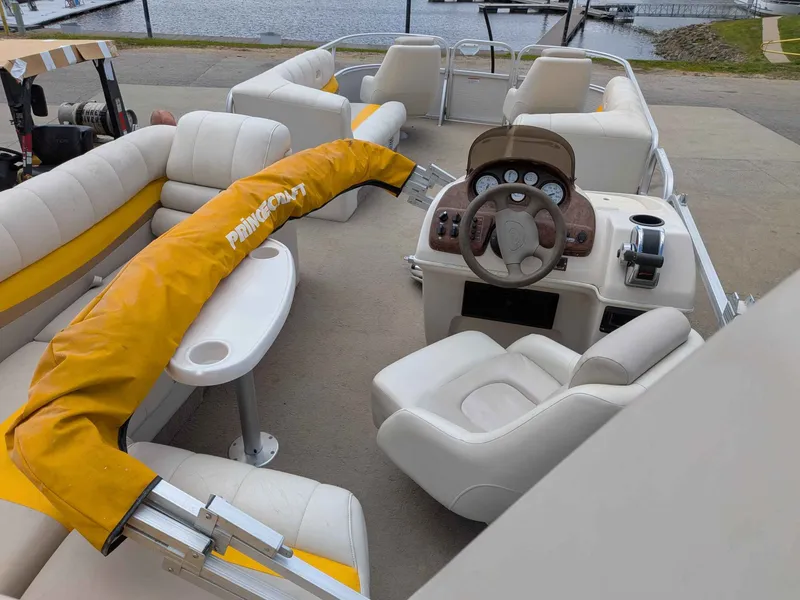 Slide: The Image of Interior of a 2005 Princecraft Pontoon boat at the dock. - 8