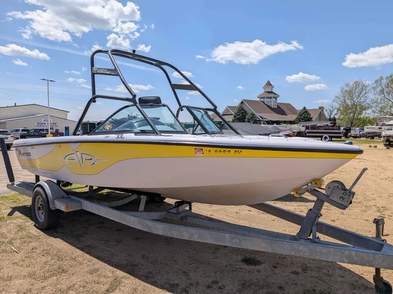 The Image of 2000 Correct Craft Air Nautique boat on trailer, sunny day. - 1
