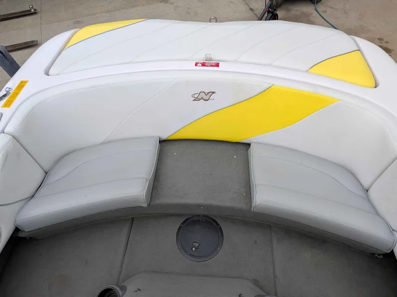 Slide: The Image of Interior of a 2000 Correct Craft Air Nautique boat with yellow accents. - 11