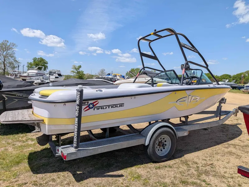 Slide: The Image of 2000 Correct Craft Air Nautique boat on trailer, sunny day. - 3