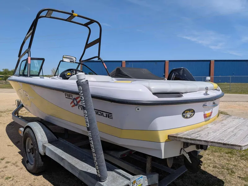 Slide: The Image of 2000 Correct Craft Air Nautique on trailer, side view. - 4