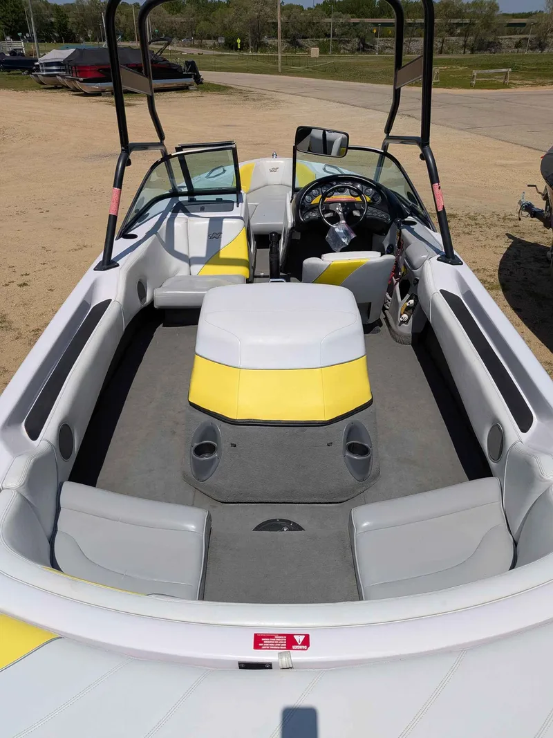 Slide: The Image of Interior of a 2000 Correct Craft Air Nautique boat with yellow accents. - 6