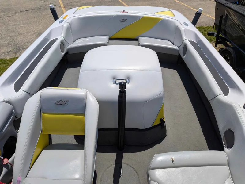 Slide: The Image of Interior of a 2000 Correct Craft Air Nautique boat with yellow accents. - 7