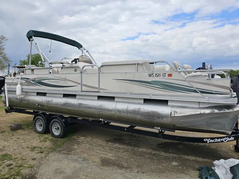 The Image of 2004 Manitou Osprey 24 pontoon boat on trailer, side view. - 1