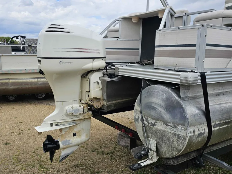 Slide: The Image of 2004 Manitou Osprey 24 pontoon boat with outboard motor. - 9