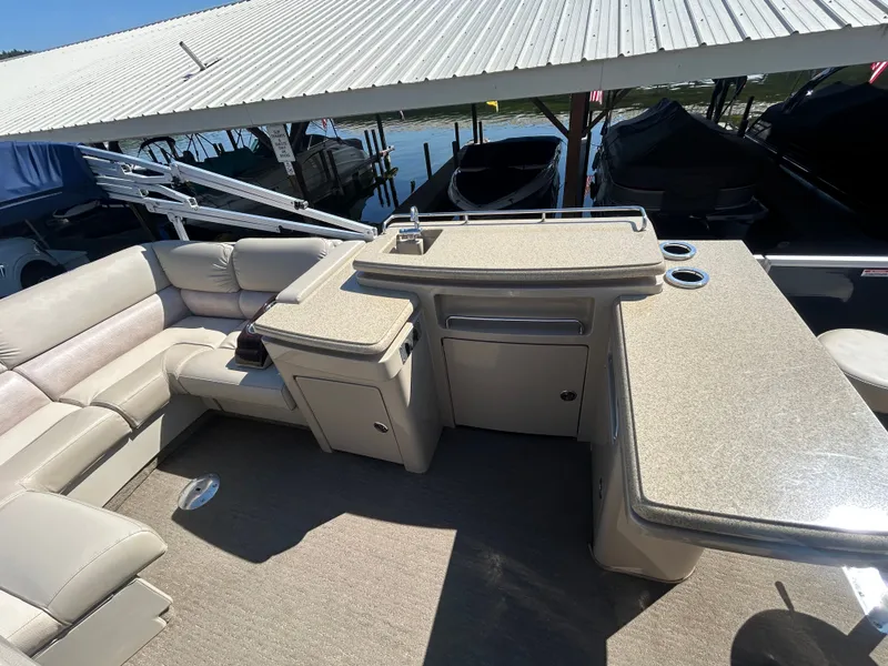 Slide: The Image of Interior of a 2014 Bennington R2550 pontoon boat at dock. - 10