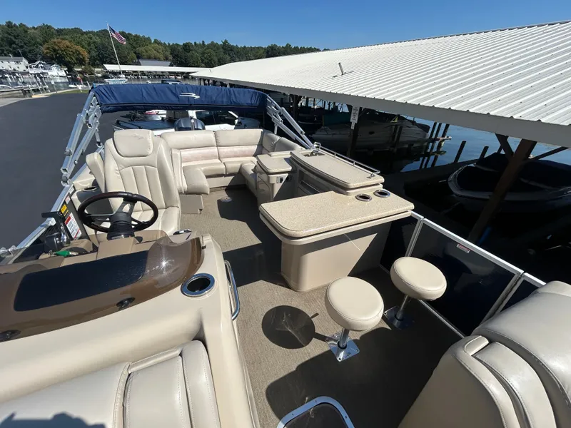 Slide: The Image of Interior of a 2014 Bennington R2550 pontoon boat at the dock. - 9