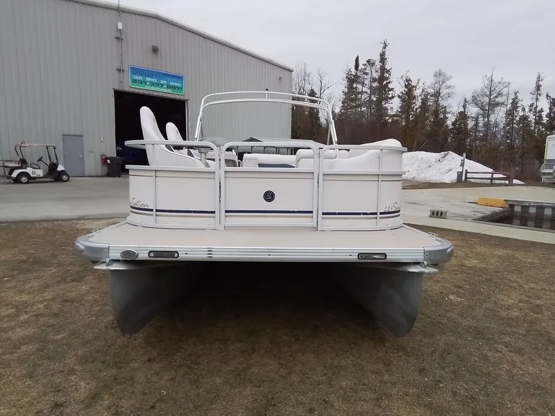The Image of 2006 Premier 225 Sunsation pontoon boat in front of warehouse. - 1