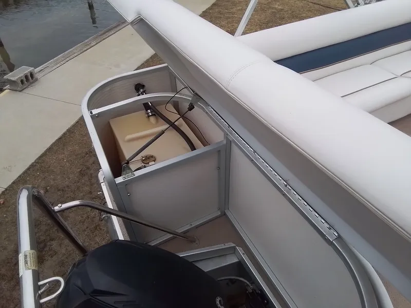Slide: The Image of Premier 225 Sunsation 2006 with open storage compartment at dock. - 17