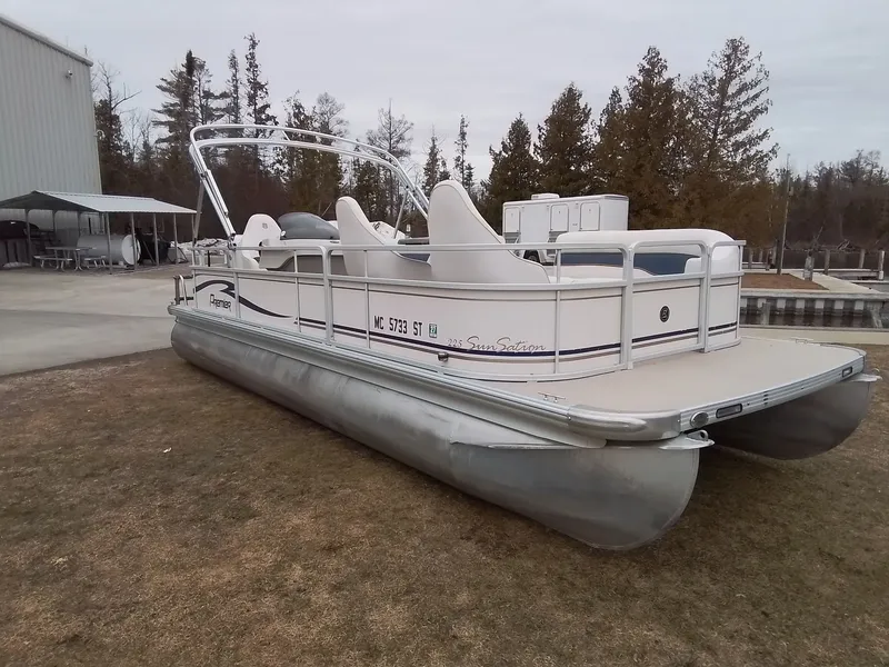Slide: The Image of 2006 Premier 225 Sunsation pontoon boat parked on dry land. - 2