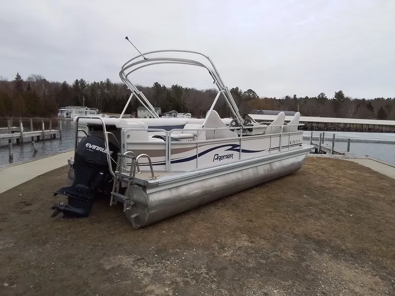 Slide: The Image of 2006 Premier 225 Sunsation pontoon boat parked by the shore. - 4
